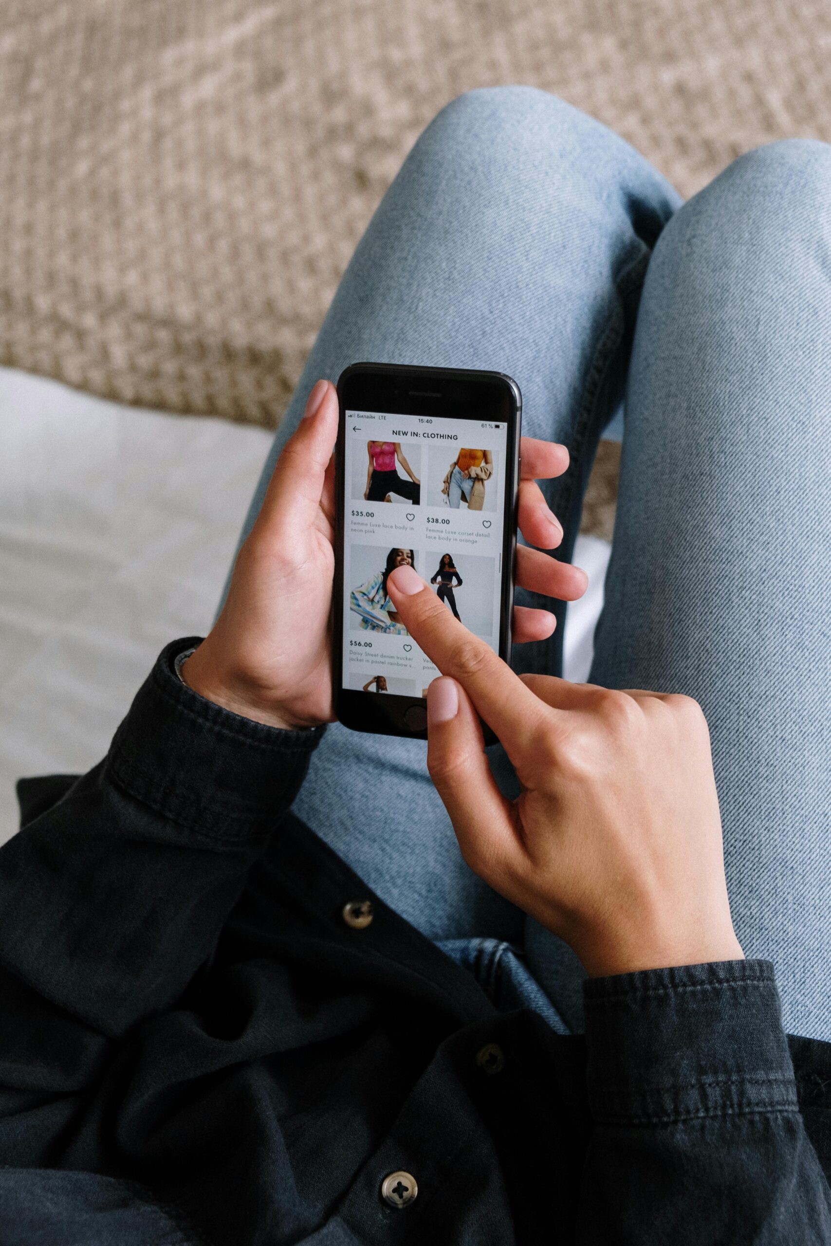 Person shopping online with a smartphone, emphasizing the power of digital marketing.