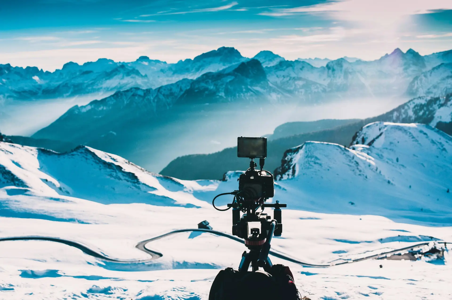 Camera setup for capturing short-form video marketing in a snowy landscape.