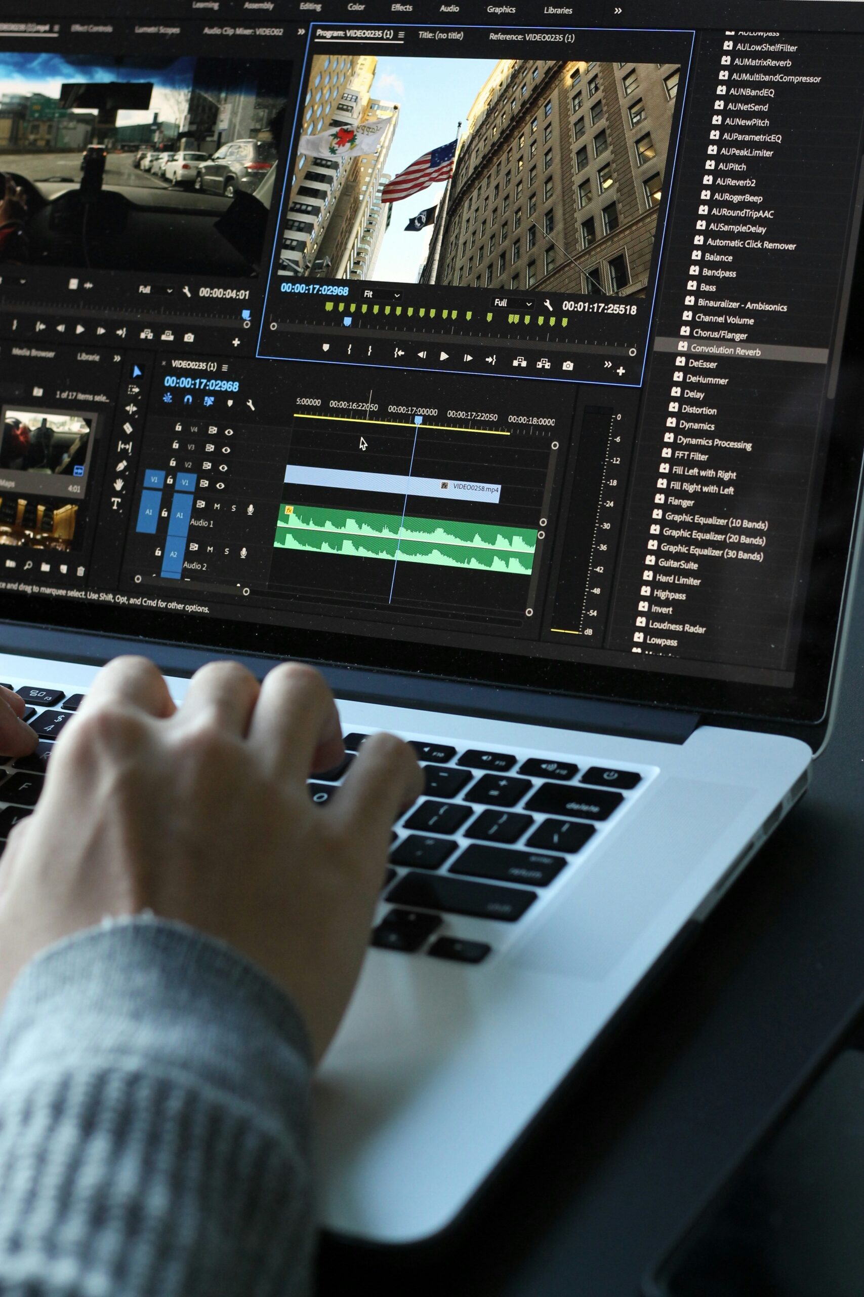 Editing short-form video marketing content on a laptop for increased engagement.